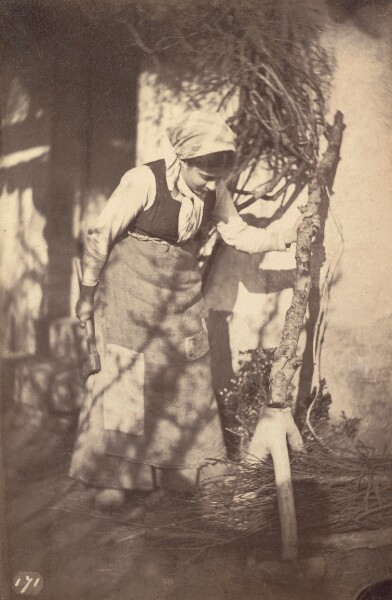 Unknown, [Woman chopping wood]