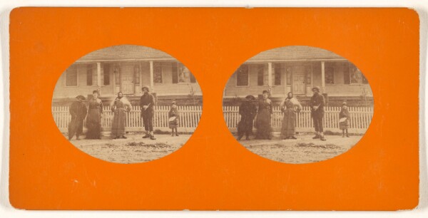 Unknown, [Family portrait in front of white picket fence]