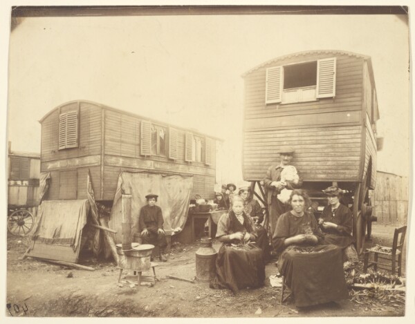 Eugène Atget, [Roma People Seated Outside of Their Wagons]