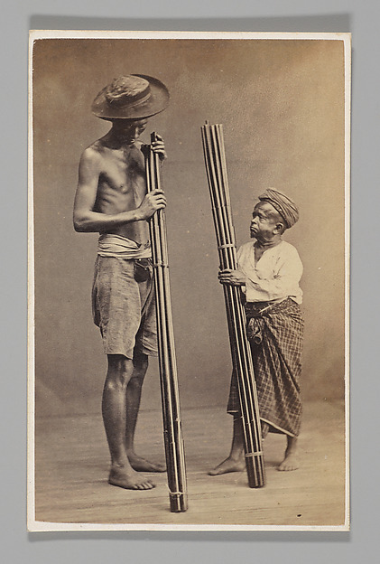 John Thomson, [Studio Portrait: Two Men each Holding Bamboo, Singapore]