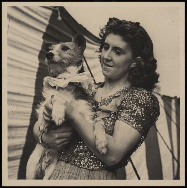 Hinde, John Wilfrid, circus performer holding a dog
