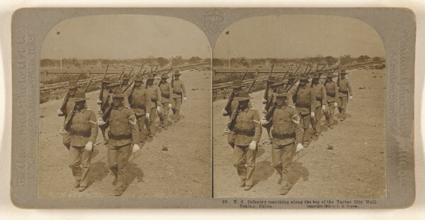 Carleton H. Graves, U.S. Infantry marching along the top of the Tartar City Wall. Peking, China.