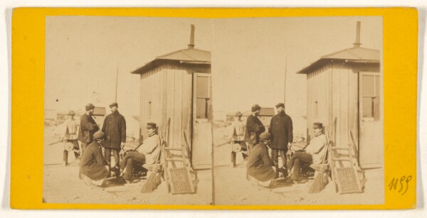 Unknown, [Group of workers in front of a house]