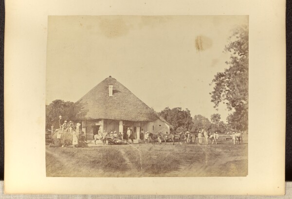 Unknown, [Workers outside a house]