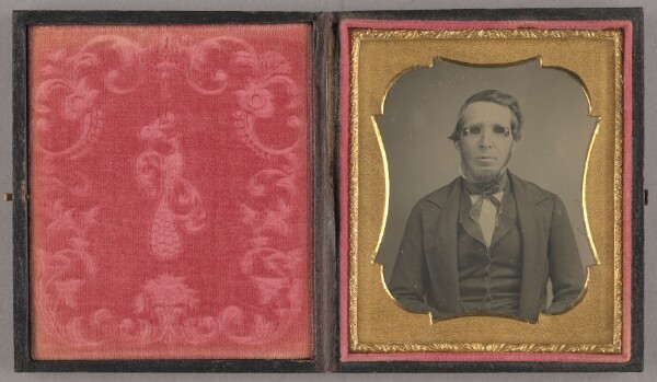 Unknown, [Portrait of a Seated Man Wearing Dark Glasses with Blinders]