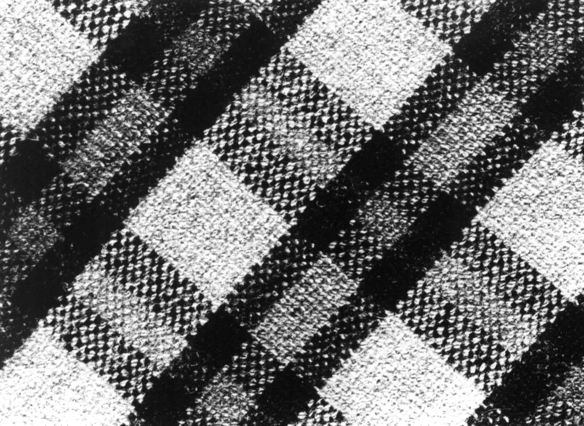 Anna Grostøl, "Kvidel", detalj av vevd ullteppe med rutemønster. Bjelland, Marnardal, Vest-Agder 1940.