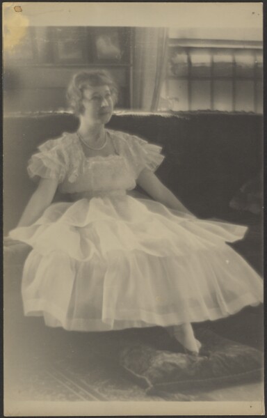 Louis Fleckenstein, [Woman in Chiffon Dress Seated on Sofa]