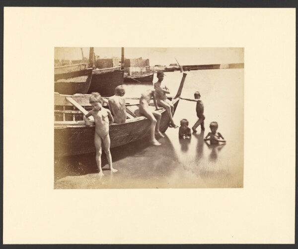 Unknown, [Boys playing around rowboat]