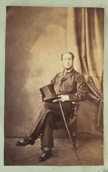 Unknown, [Portrait of a seated man holding a top hat]