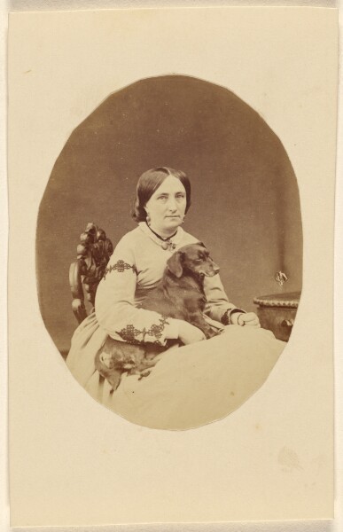 Unknown, Miss C. Barrett [with a dog in her lap]