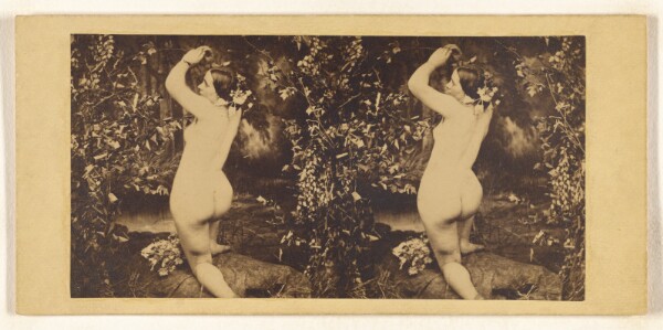 Unknown, [Nude woman in fake forest studio setting, in nymph-like pose]