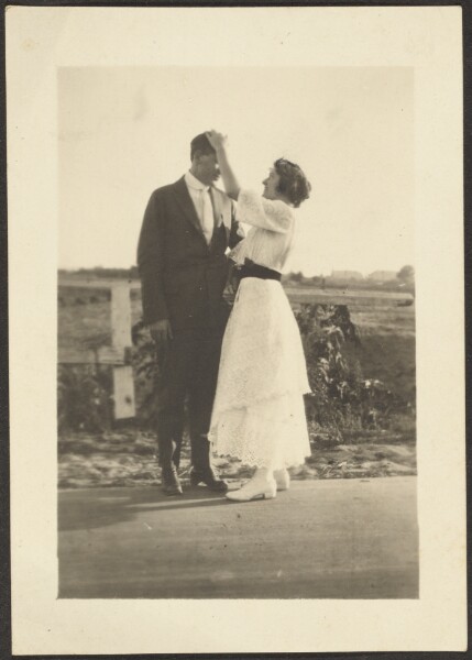 Louis Fleckenstein, [Man and Woman Dressed Up on Roadside]