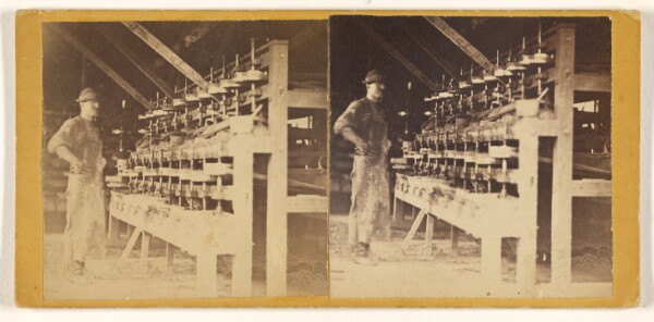 Unknown, [Man at thread machine]