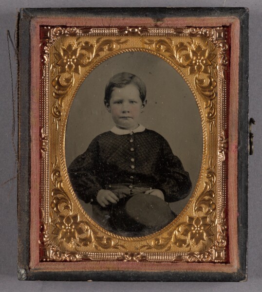 Unknown, [Portrait of a Seated Boy with Hat on Lap]