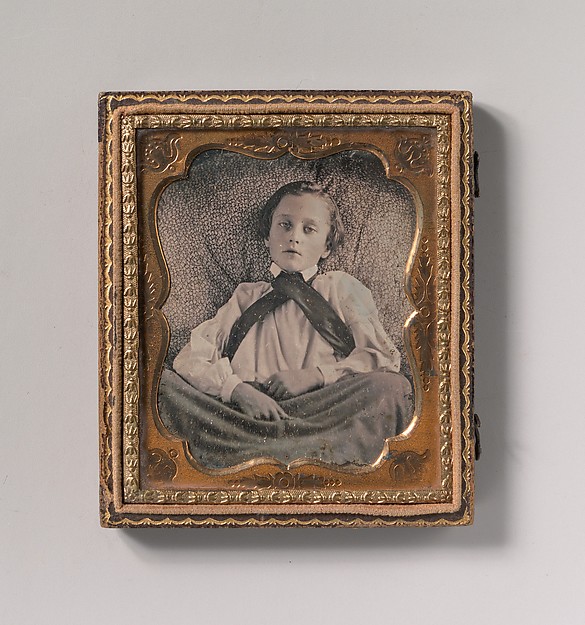 Unknown, [Boy Seated Cross-legged, Partially Covered by Blanket, Leaning Against Cushion]