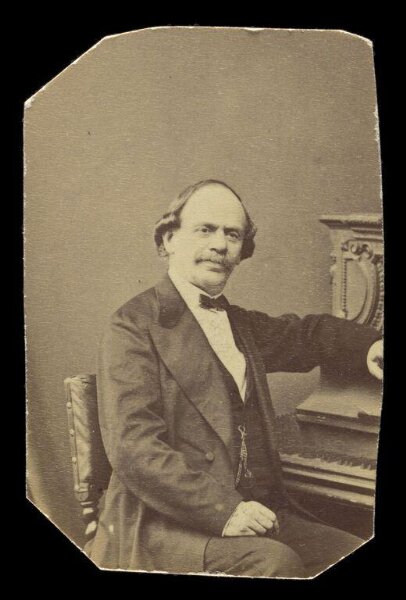 London Stereoscopic and Photographic Company, A portrait of a man at piano