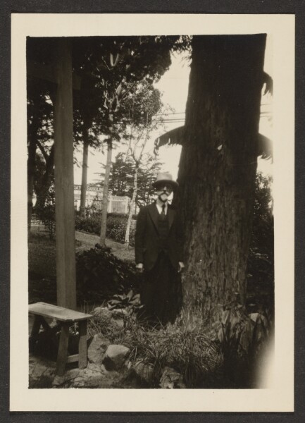 Louis Fleckenstein, [Man in Pith Helmet by Tree]