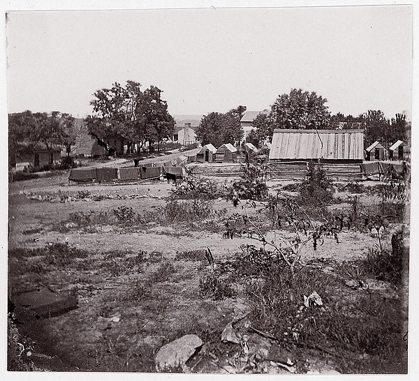 Unknown, [View of a small town with wooden sheds in distance].  Brady album, p. 123