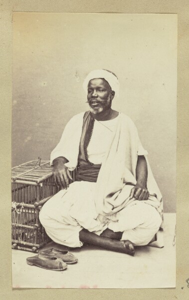 Unknown, [Portrait of man sitting cross-legged in robes]