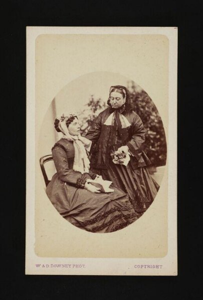 W. & D. Downey, Queen Victoria and another woman with a book