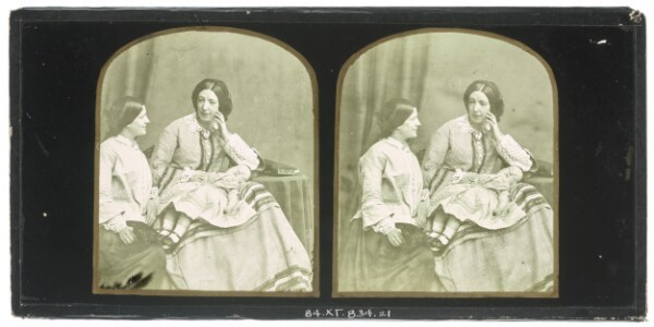 Unknown, [Two women seated, a child sleeping on lap of one of them]