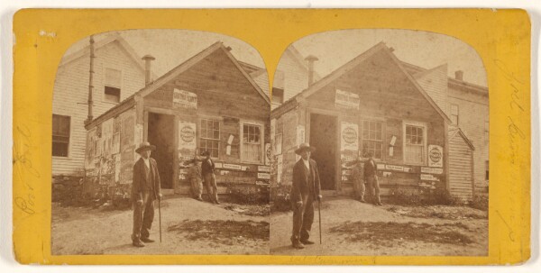 Unknown, [Exterior view of a building with many posted bills, etc. an old man with a cane and a few boys standing out front]