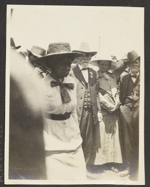 Unknown, [View of Men and Women Standing Together]