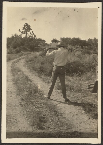 Louis Fleckenstein, [Man on Trail with Gun]