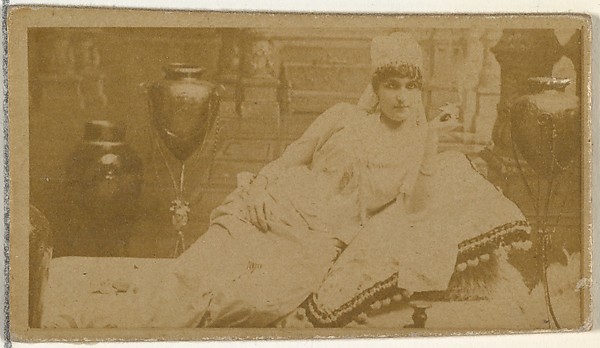 W. Duke, Sons & Co., [Reclining actress surrounded by vases], from the Actors and Actresses series (N145-8) issued by Duke Sons & Co. to promote Duke Cigarettes