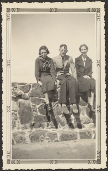 Louis Fleckenstein, [Three People Seated on Stone Wall]