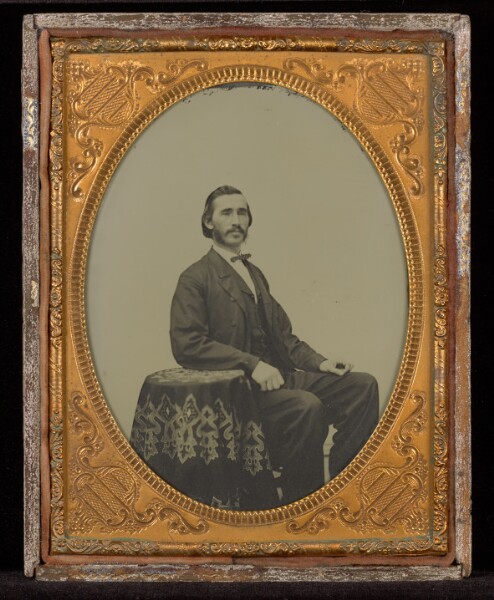 Unknown, [Portrait of a Man Seated at a Cloth Covered Table]