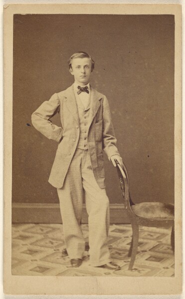 Unknown, [Unidentified well-dressed young man wearing a bowtie, standing]
