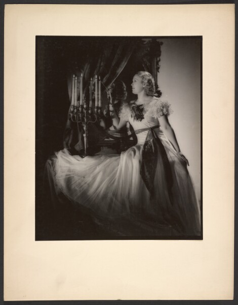 Günther Krampf, [Woman lighting candelabra]