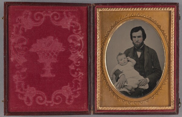 Unknown, [Portrait of a bearded man seated, holding a baby]