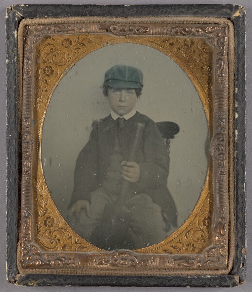 Unknown, [Portrait of a Seated Boy in Cap Holding a Cricket Paddle]