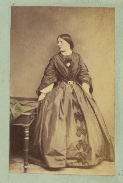 Unknown, [Portrait of woman wearing dress with bows]