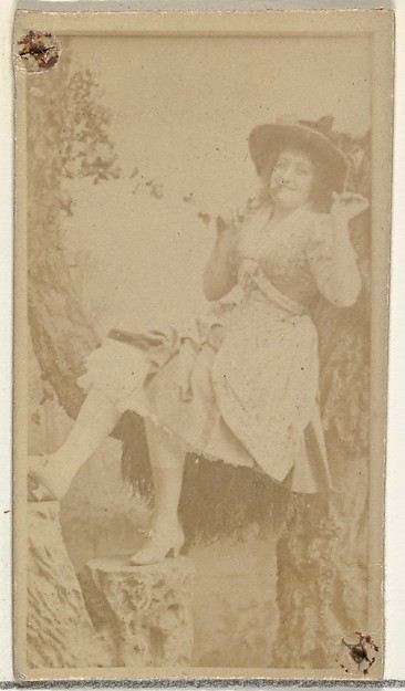 W. Duke, Sons & Co., [Actress in studio reclining against prop trees], from the Actors and Actresses series (N145-8) issued by Duke Sons & Co. to promote Duke Cigarettes