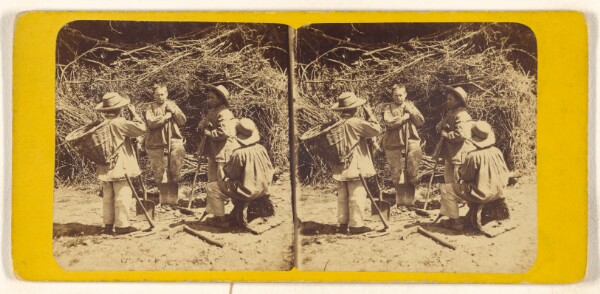 Unknown, [Four young men digging in a garden]
