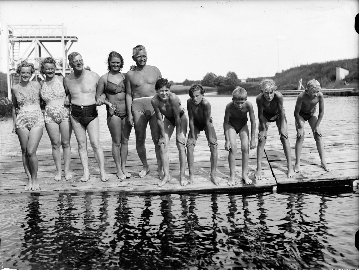 Paul Sandberg, Bathmasters R Gustafsson and other bathers at Fyrisbadet, Uppsala July 1944