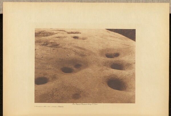 Edward S. Curtis, A Bowlder Milling-stone - Miwok