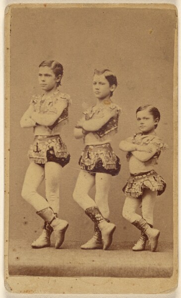 Unknown, [Three young male dancers or circus performers]