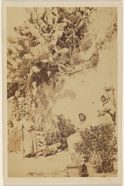 Unknown, [Unidentified women and children near a hill with cacti]