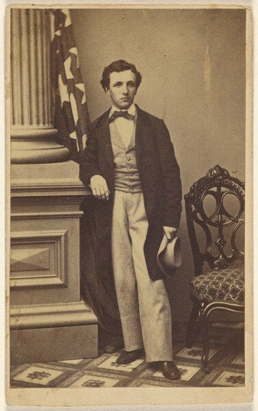 Unknown, [Unidentified man holding a hat, standing]