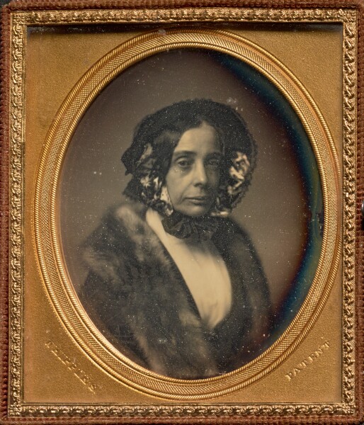 J. A. Whipple, [Portrait of a Middle-aged Woman in Bonnet and Fur Wrap]