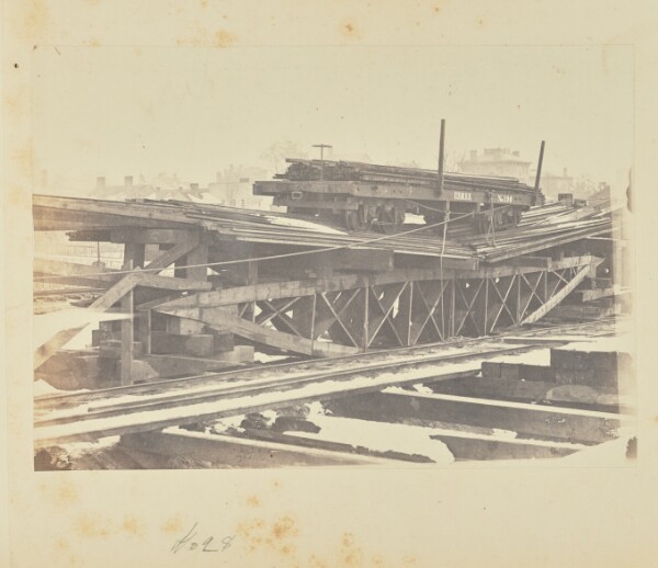 A. J. Russell, Bridge of Board Trusses Loaded Until it Broke at Two Tons per Foot