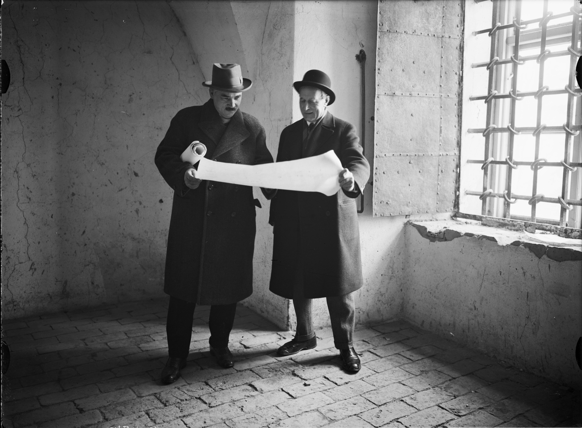 Okänd,, Two men study drawings in Uppsala Castle, Uppsala