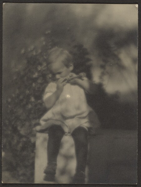 Louis Fleckenstein, [Child Eating Drumstick in Garden]