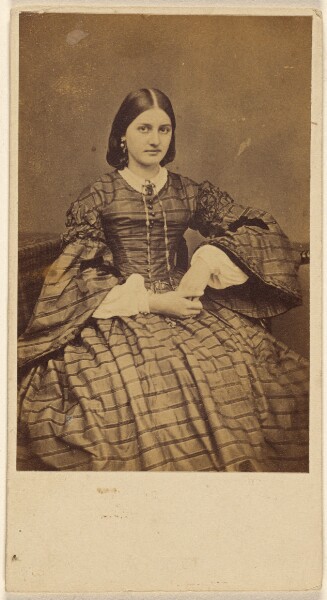 Unknown, [Young woman in striped dress, seated]