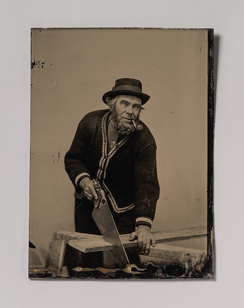 Unknown, [Carpenter Sawing a Plank of Wood]