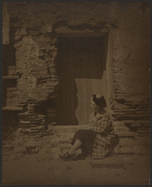 Louis Fleckenstein, [Woman Seated Before Deteriorating Building]
